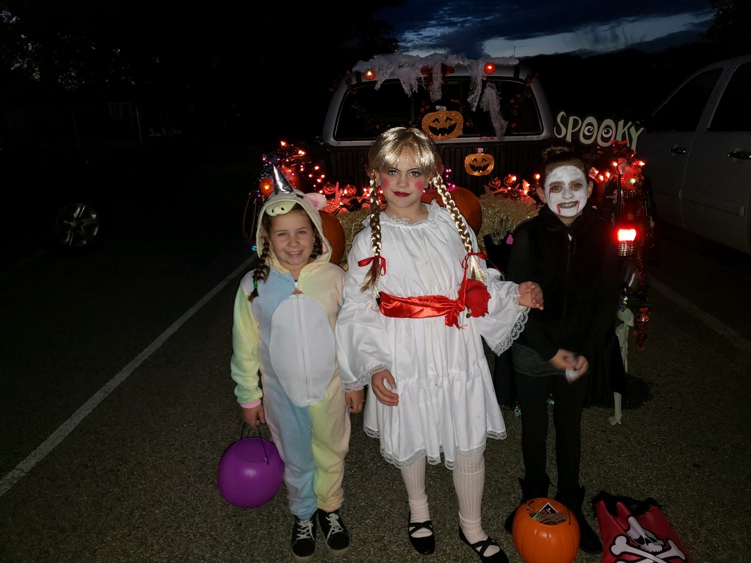 Students from St. Mary School in Cranston take part in the school’s Trunk or Treat tradition on October 26. Pictured from left to right are third graders Belle Bradley, Rachele Natalia Beeley and Lily Sherman.